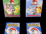 three packs of pokemon trading cards on a black background