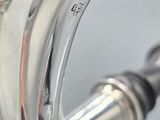 silver plated coffee pot with a handle and a handle