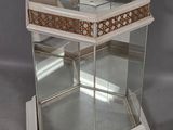 a glass display case with a mirror in it