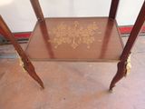 a small table with a gold design on it