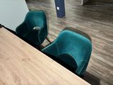 two chairs that are sitting next to each other