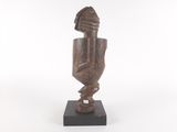 an image of a wooden sculpture of a woman ' s head and hands