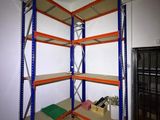 a room that has a shelf with several shelves on it