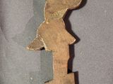 wooden crucifix with jesus on the cross on a gray background