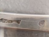 a small piece of metal that has been cut in half