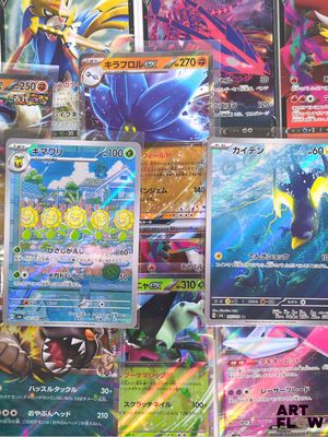 many different types of pokemon cards on the table