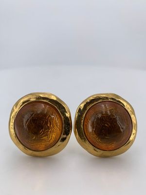 an image of a pair of gold toned earrings with a tiger ' s eye