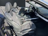 the interior of a car with the driver ' s seat folded down
