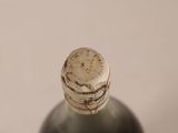 a bottle of wine with a cork on the top of it