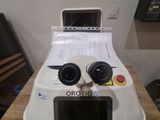 a polaroid camera sitting on top of a wooden table