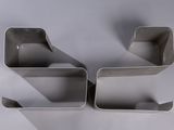 three pieces of cookie cutters sitting on top of a white surface
