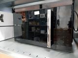 an image of a refrigerator in a kitchen with the door open