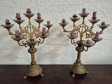 pair of antique brass candelabs with pink candles