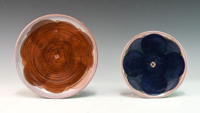two plates that are sitting side by side on a table