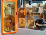 a bottle of liquor next to a bottle of liquor and a bottle of liquor
