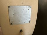 a close up of a metal plate on the side of a vase