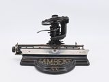 an old fashioned sewing machine on a white surface