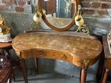 a small table with a mirror on top of it