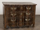 an antique chest of drawers with a marble top on a herringle floor