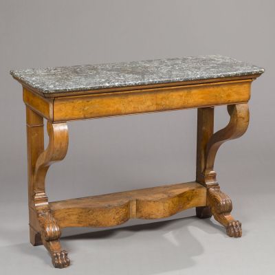 an old wooden table with a marble top on a gray background