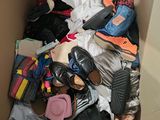 a box full of clothes and shoes in it