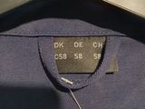 a close up of a shirt with a tag on it