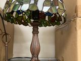a lamp that is sitting on a shelf next to a box