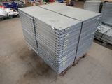 several stacks of steel plates stacked on top of each other in a warehouse