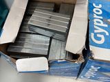 a box full of staples and staples sitting on a table
