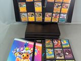 a collection of pokemon trading cards on display on a table