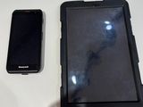 a cell phone sitting next to a cell phone on a table