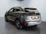a silver car that is parked in a showroom