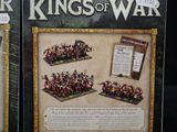 pair of two boxed games of kings of war, including a battle scene and a battle scene