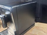 an image of a coffee machine on a wooden table