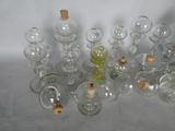 a lot of empty glass bottles with corks on them
