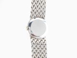 a close up of a silver watch with a white background