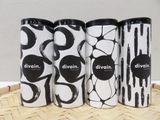 three cans of divinn are lined up on a bamboo tray