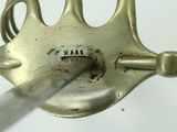 a metal fork with a handle that has the word ram written on it