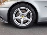 a silver sports car parked on the side of the road