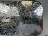 a silver tray with a picture of a cat on it
