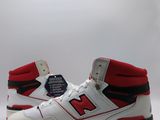 the new balance shoes are white and red with black accents