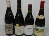 several bottles of wine are lined up on a table