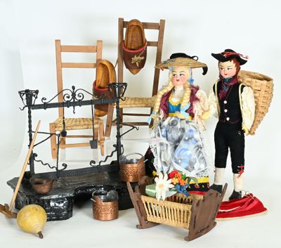 a figurine of a man and a woman standing next to a chair
