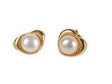 a pair of pearl earrings on a white background