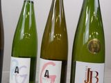 several bottles of wine are lined up on a table