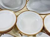 a lot of plates that are sitting on a table