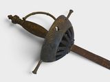 a small metal object with a wooden handle on a white surface