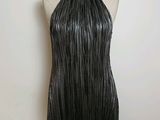 a black leather dress with fringes on a mannequin mannequin mannequin mannequin mannequin mannequin mannequin manne