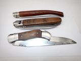 three different types of knives sitting on a table