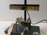 an image of a knife and a knife sharper on a stand